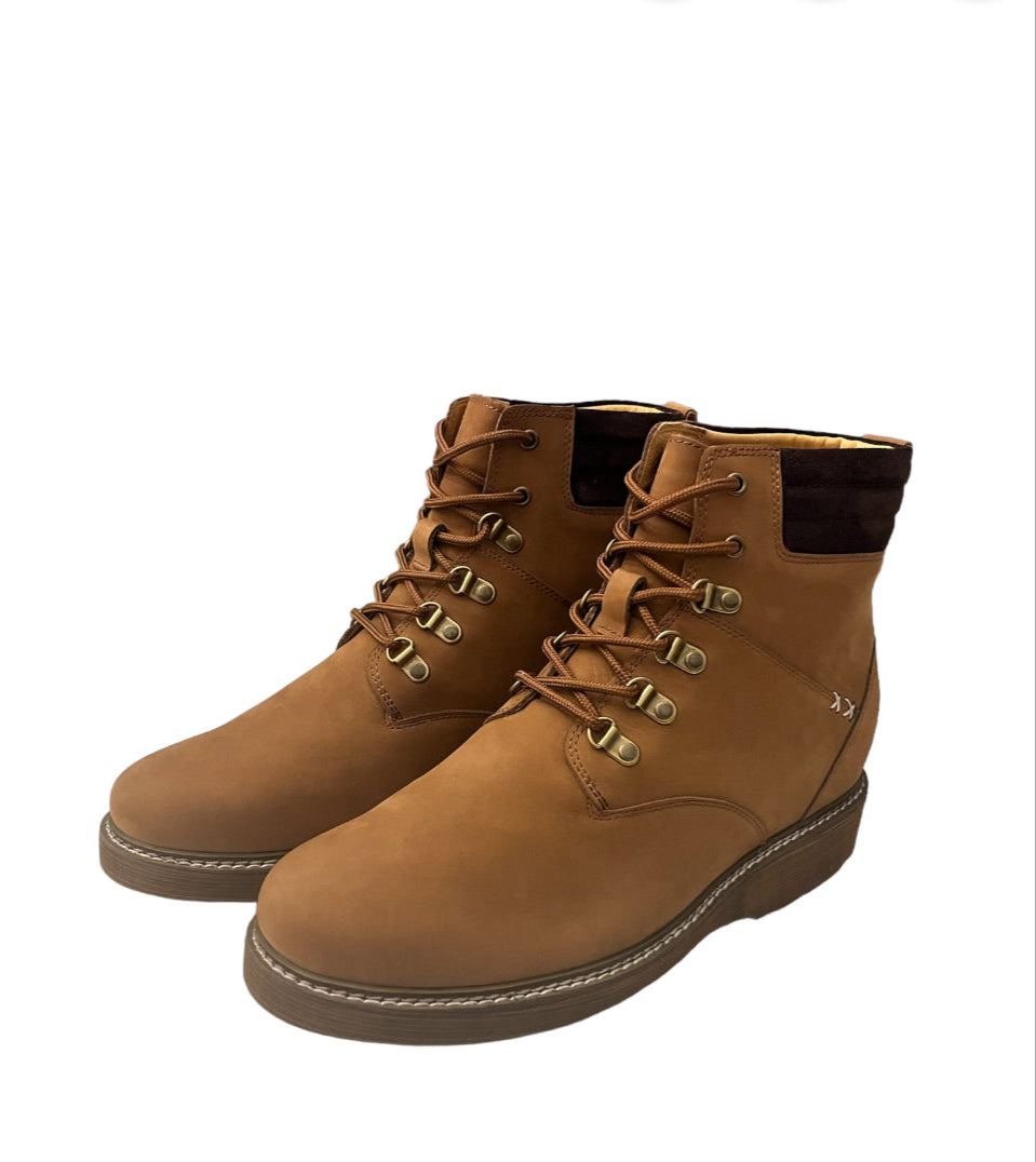 Pair of brown leather boots on a white background