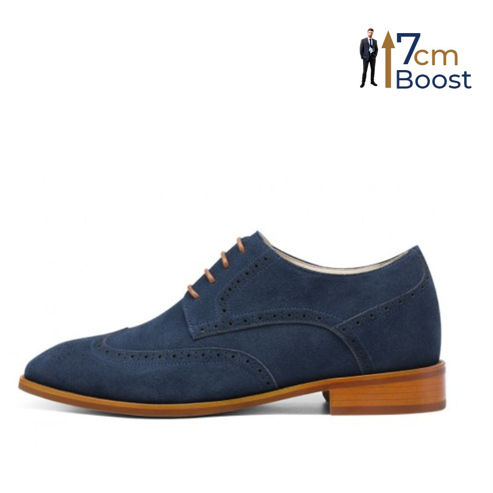 A pair of blue suede height-increasing derby shoes with fine brogue stitching, displayed against a white background.