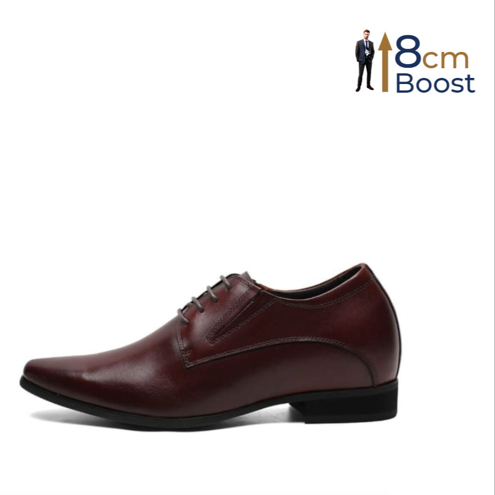 A brown, pointed-toe, double-stitched leather shoe designed for formal wear, with a visible heel and lace-up closure.