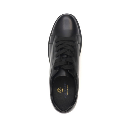 Black leather shoe on a white background